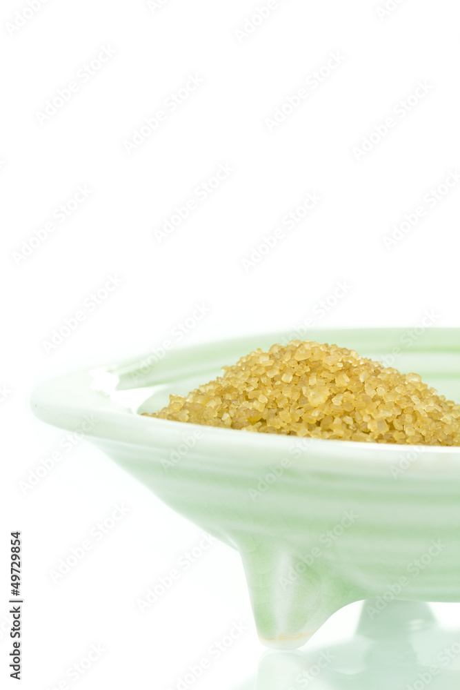 Lightly refined crystallized raw sugar in bowl Lightly refined crystallized raw sugar in bowl