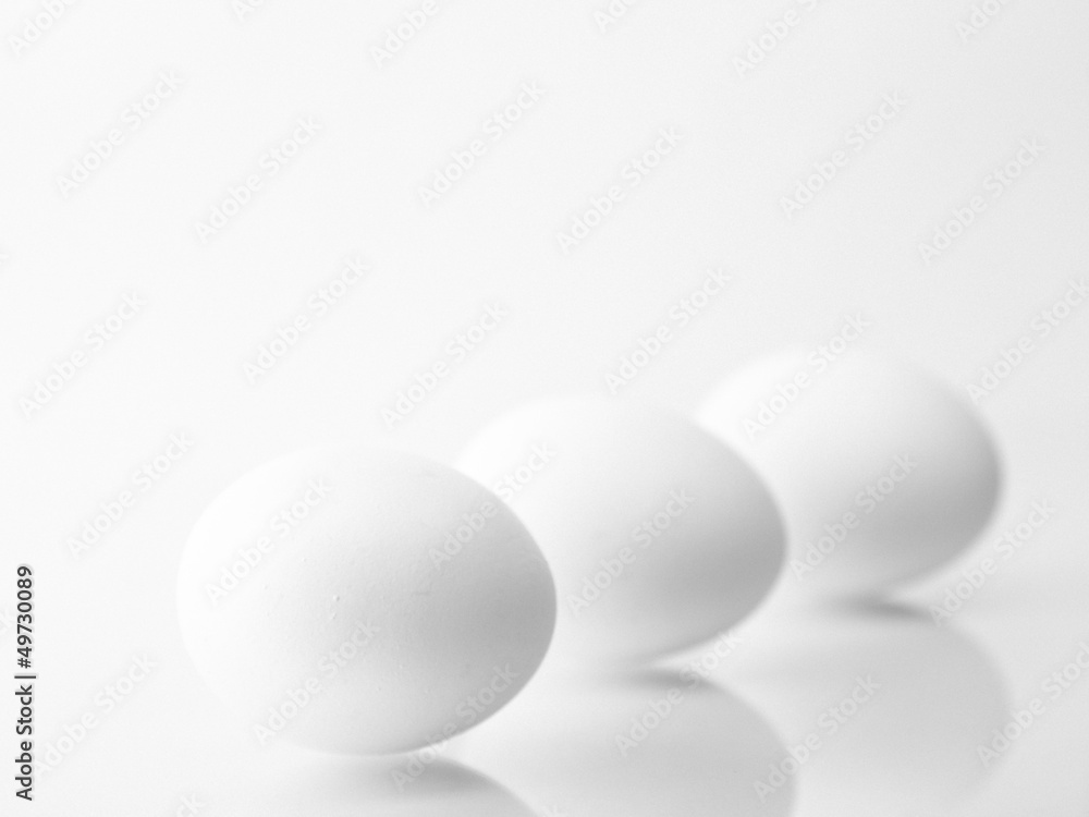 Chicken eggs, black and white with grain
