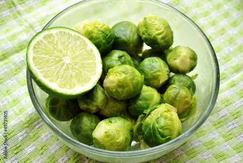 Fresh Cooked Bussel Sprouts in a Bowl with Lime photo