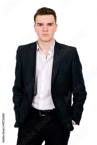 Portrait of businessman standing with his hands in the pockets