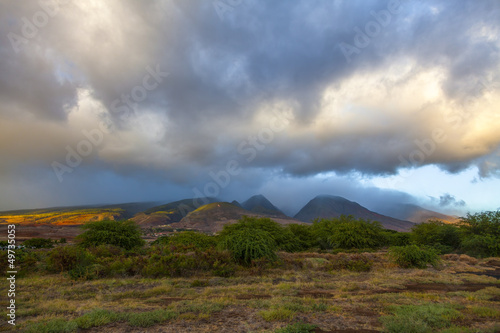 Sun breaks through dramatic storm clouds and shines on West Maui