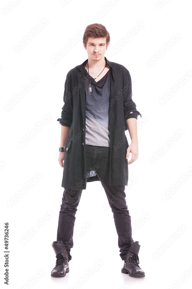 young man stands in studio young man stands in studio