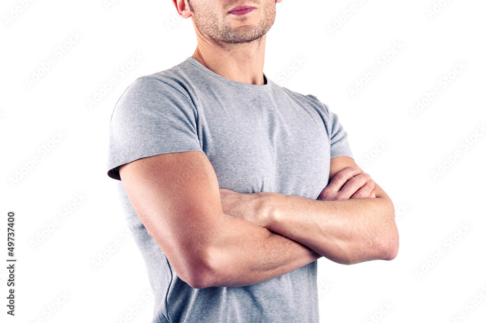 Crossed arms close up of muscular man on white background. Stock Photo