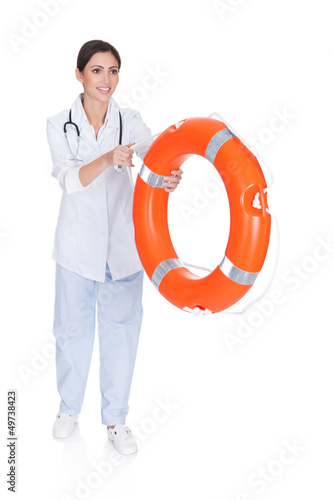 Smiling Female Doctor Holding Inflatable Ring