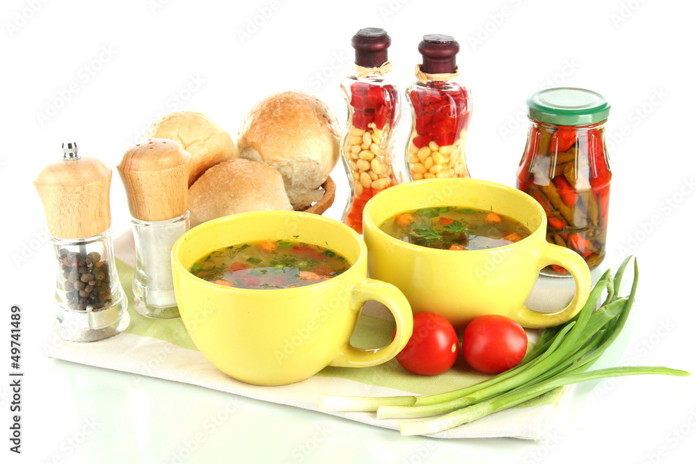 Fragrant soup in cups isolated on white Fragrant soup in cups isolated on white