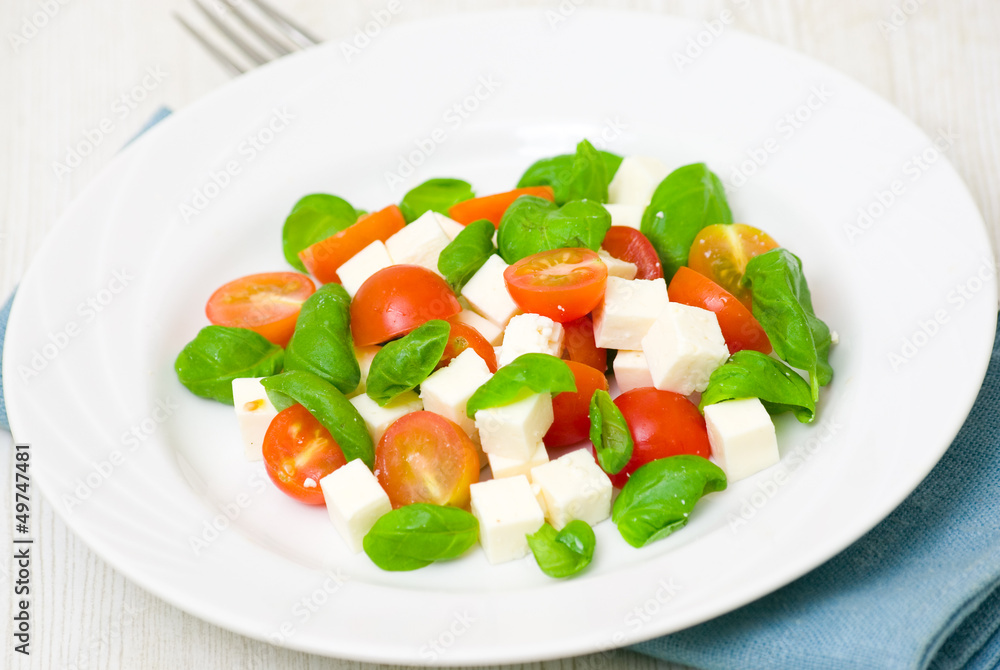 salad with tomato, cheese and basil