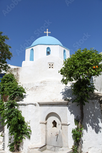 Church and orange tree on Paros island