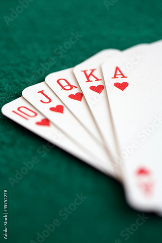 Fotografía Straight royal flush playing cards, poker hand in hearts