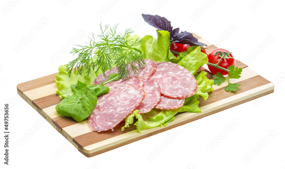 Fototapeta premium Sausages with salad and basil