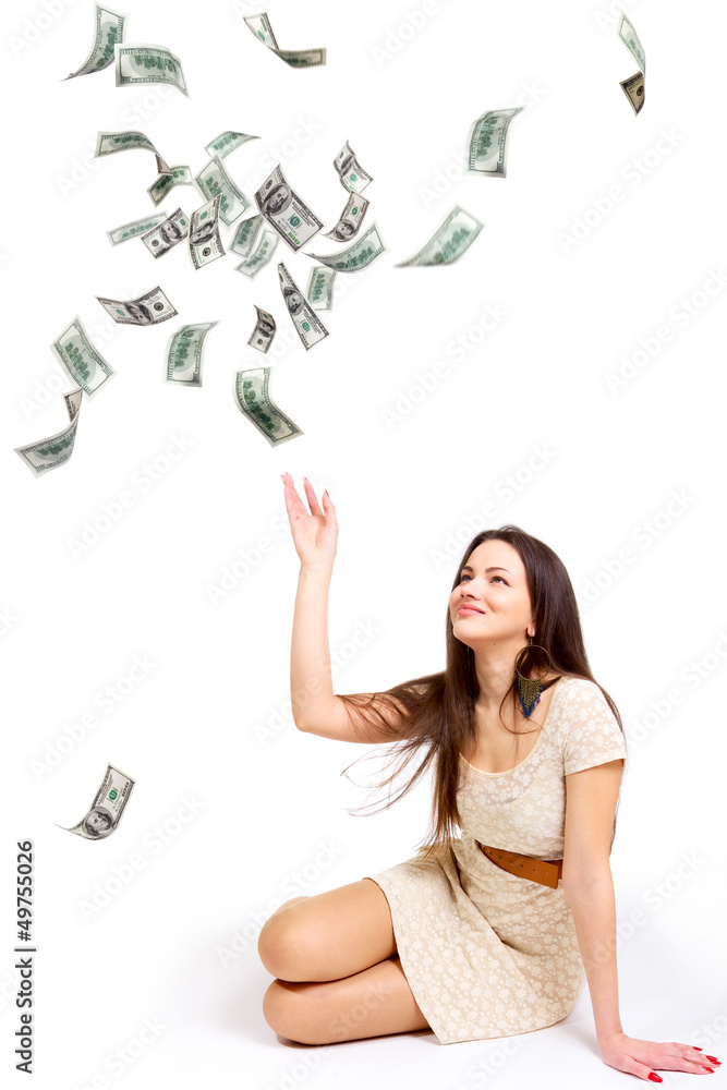 Young woman throwing money up isolated on white Young woman throwing money up isolated on white