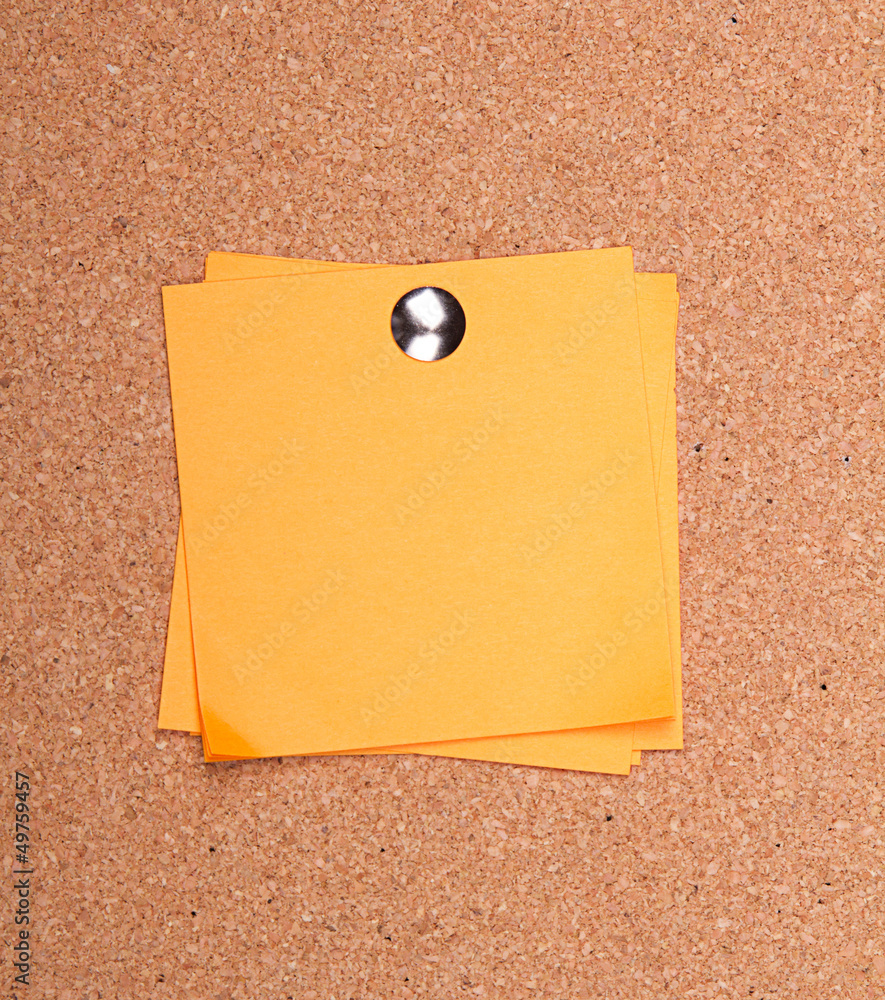 sticky note on a bulletin board sticky note on a bulletin board