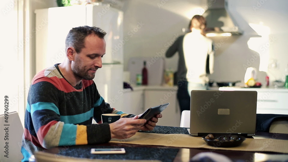 Happy man with tablet computer in home Happy man with tablet computer in home