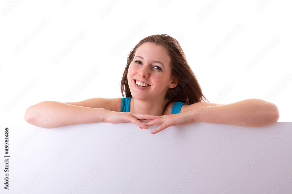Beautiful brunette holding empty white board with copy space Beautiful brunette holding empty white board with copy space