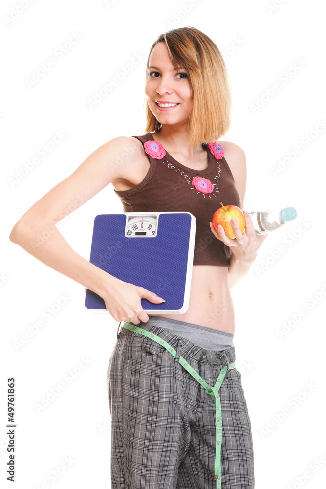 Beautiful young caucasian woman measuring her body with tape iso Beautiful young caucasian woman measuring her body with tape iso