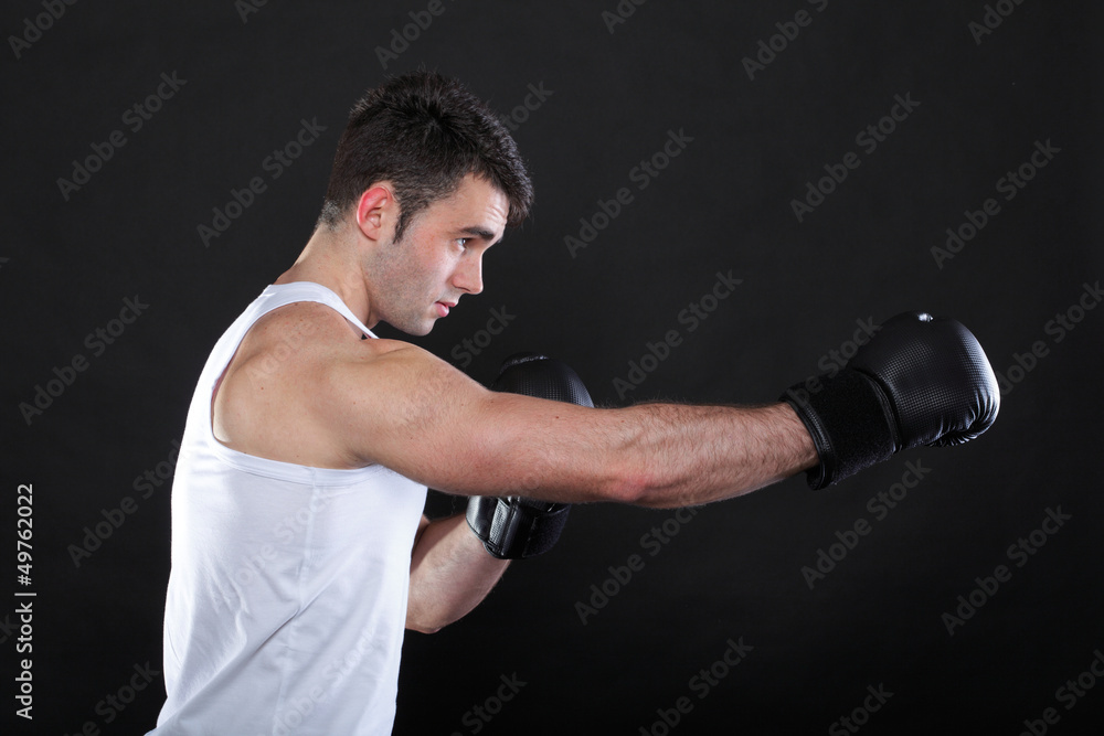 Portrait sportsman boxer in studio dark background