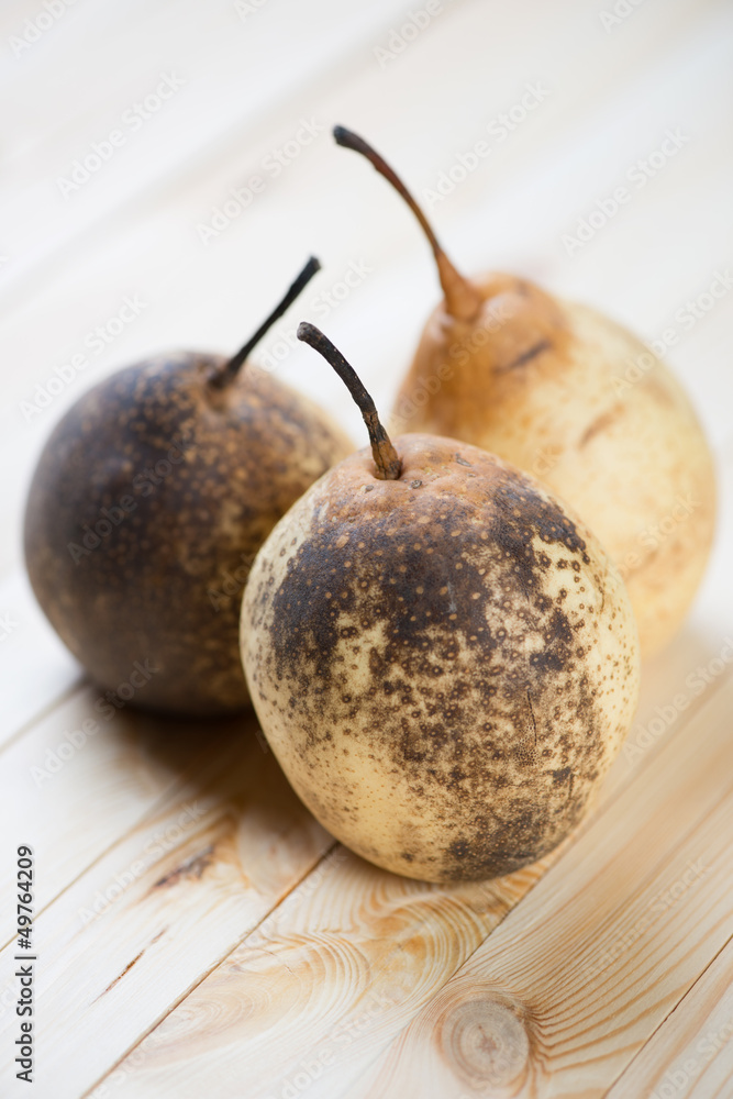Chinese pears on wooden boards, vertical shot Chinese pears on wooden boards, vertical shot