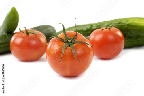 Three tomatoes and cucumbers
