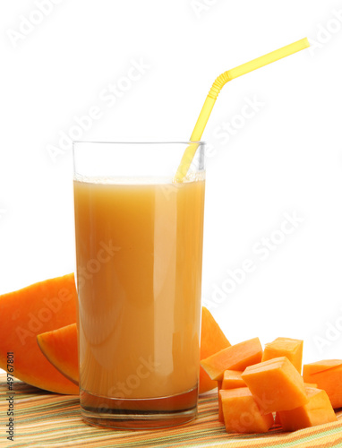 Glass of tasty pumpkin juice and pumpkin, isolated on white