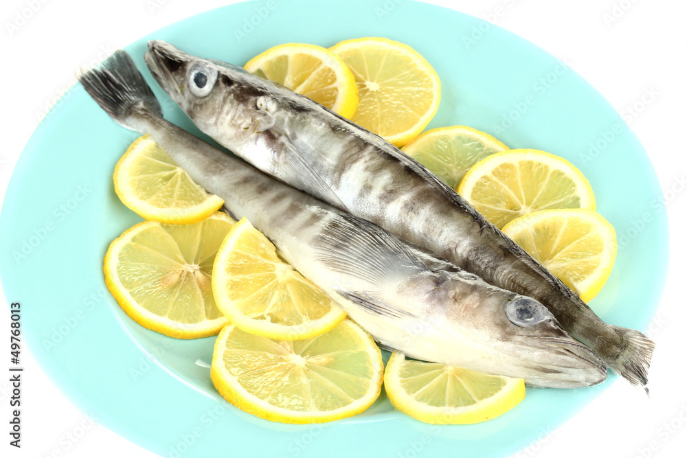 Fresh fish with lemon on plate isolated on white