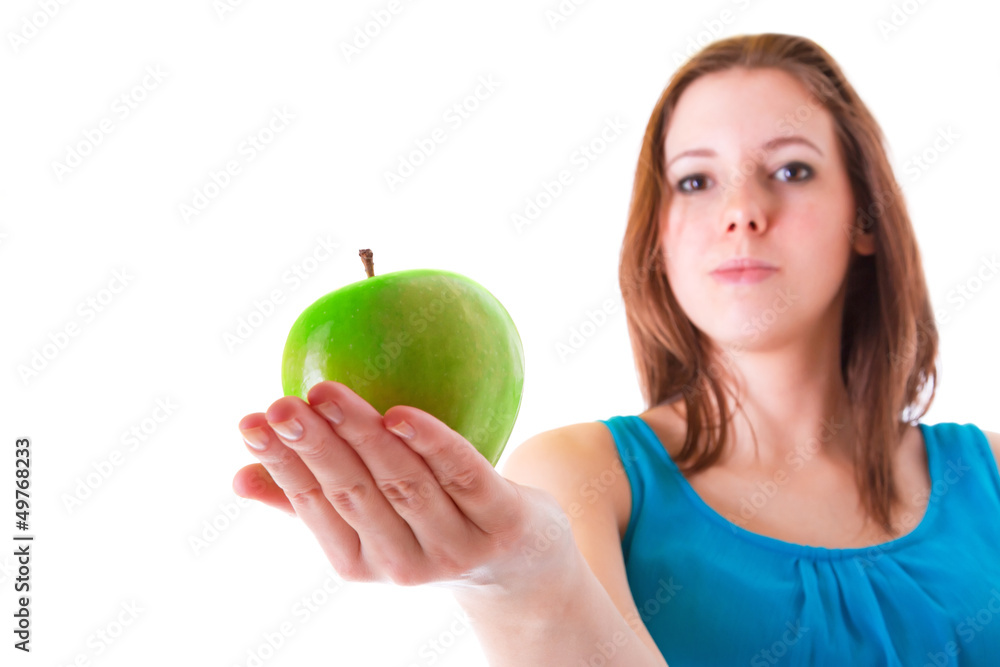 Young woman giving healthy green apple Young woman giving healthy green apple