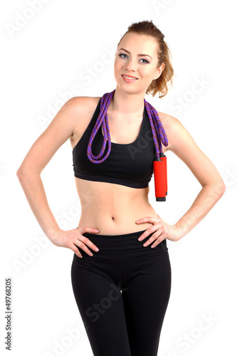 Young woman with skipping rope isolated on white