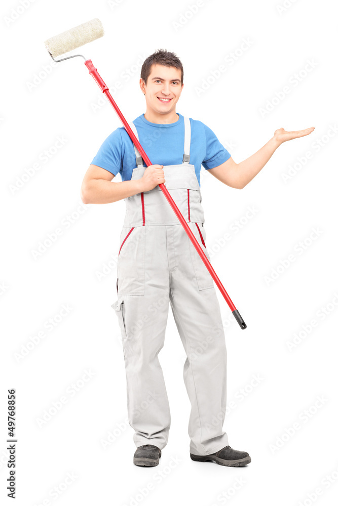 Full length portrait of a painter in a uniform with a brush poin Full length portrait of a painter in a uniform with a brush poin