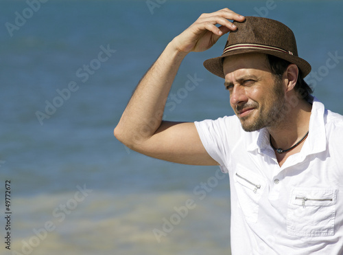 casual man on the beach © gdvcom