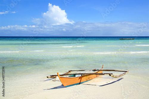 Picturesque seascape with boat. Anda beach, Philippines photo