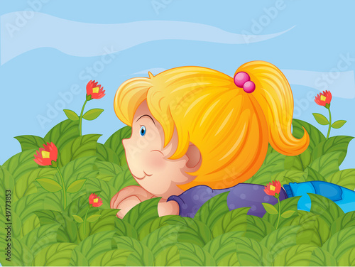 A little girl hiding in the garden