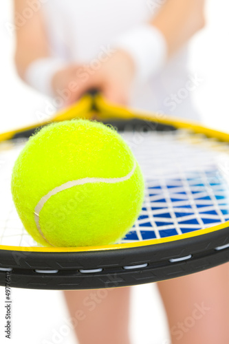 Closeup on ball on racket in hand of tennis player © Alliance
