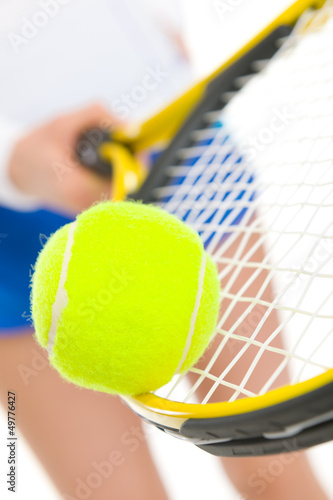 Closeup on tennis player balancing ball on racket © Alliance