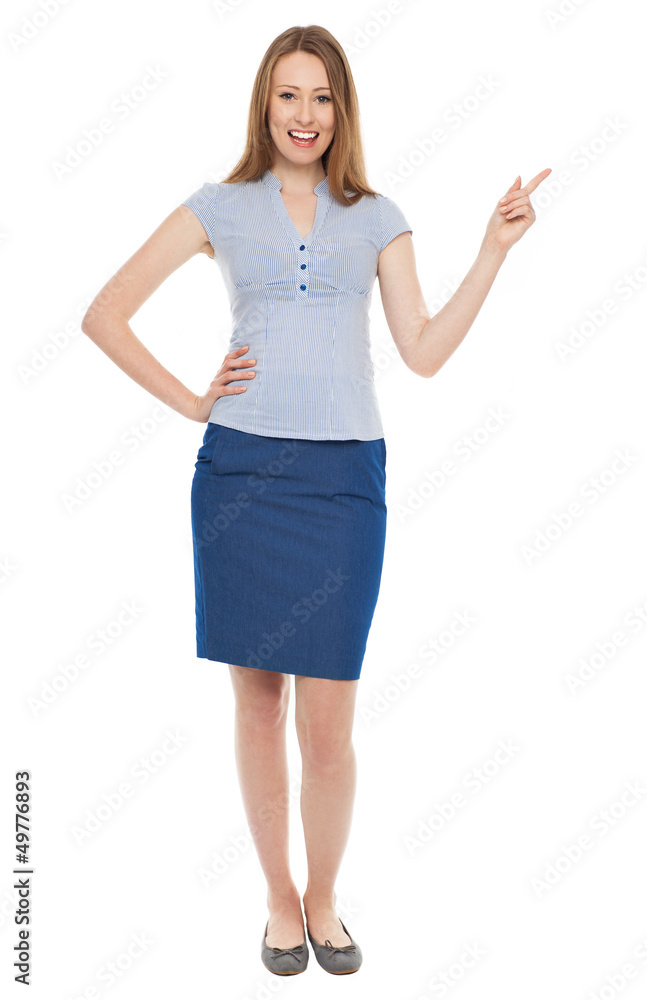 Young businesswoman pointing up Young businesswoman pointing up