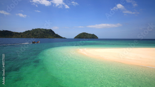 Long tail boat sailing on Andaman crystal sea, Thailand