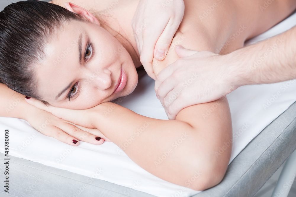 Woman getting body massage at spa salon Woman getting body massage at spa salon
