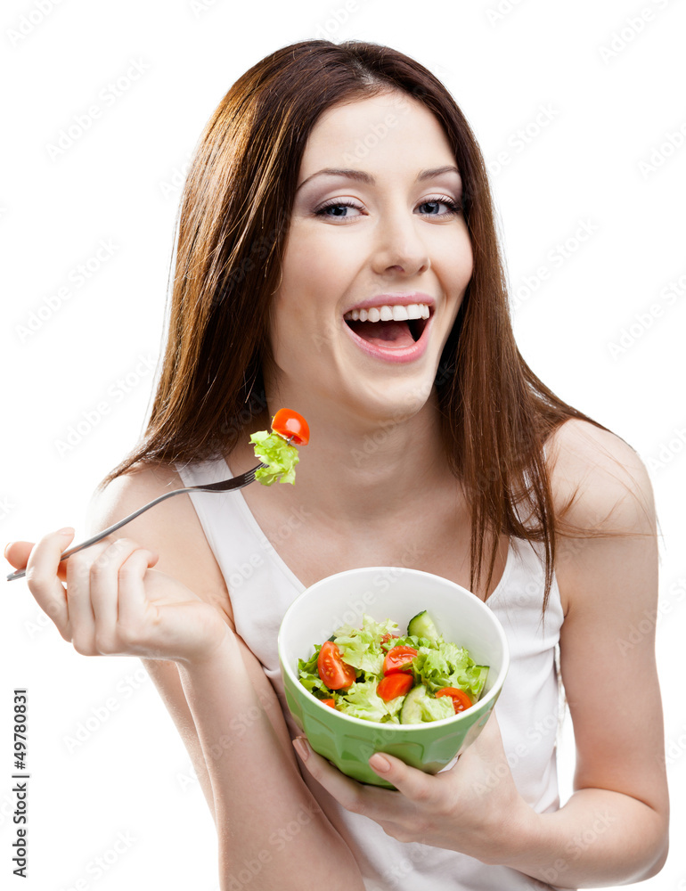 Dieting woman eats green salad in salad bowl, isolated on white Dieting woman eats green salad in salad bowl, isolated on white