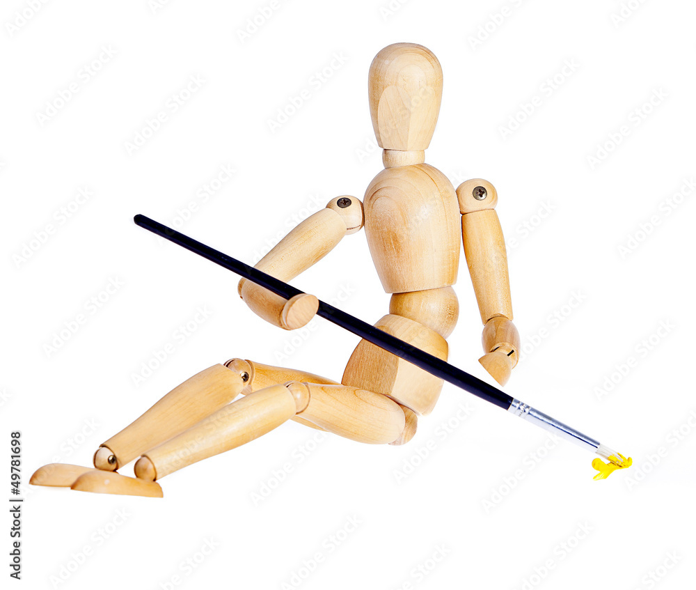 Wooden figures sitting with brush