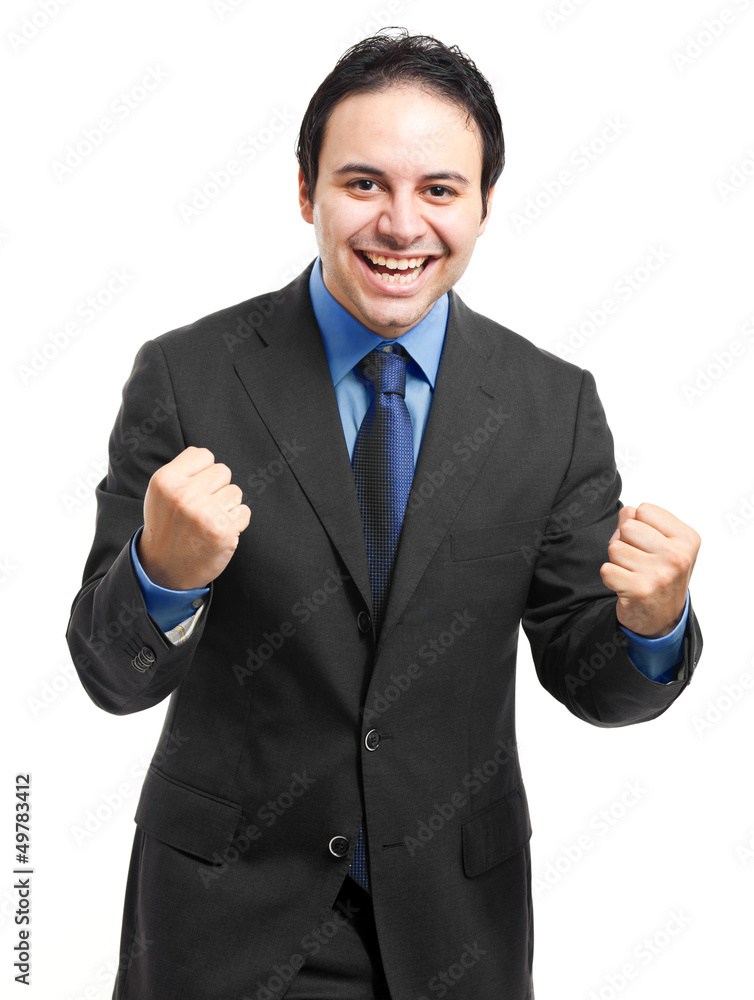 Business man throwing fists in air and smiling Business man throwing fists in air and smiling
