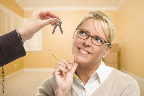Woman Being Handed Keys in ...