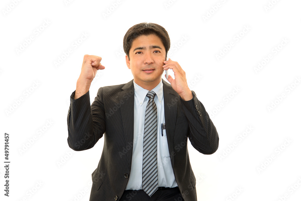 ガッツポーズのビジネスマン