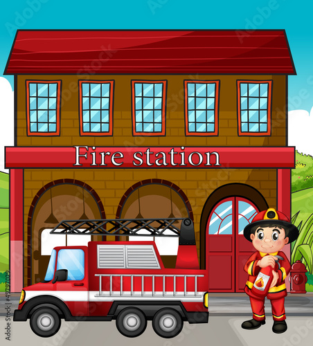 A fireman with a fire truck in a fire station