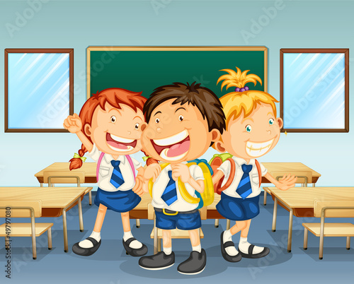 Three children smiling inside the classroom