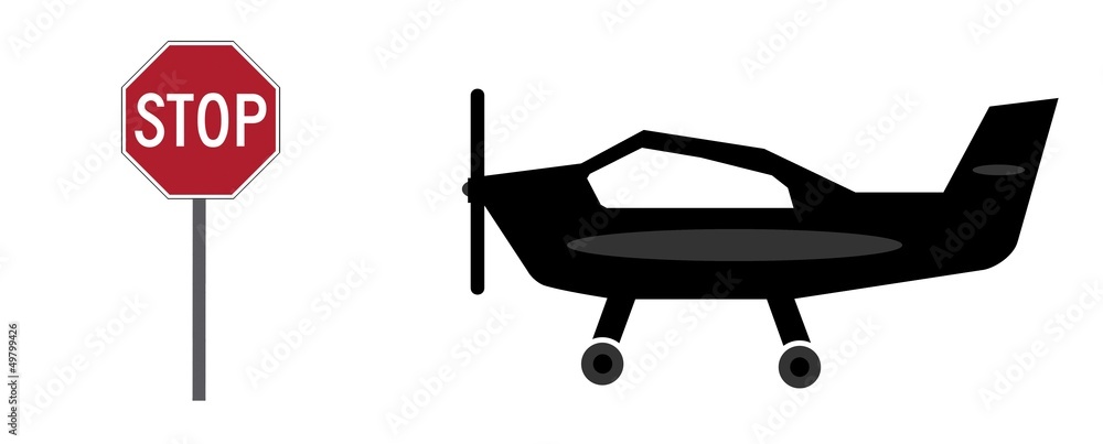 Avion à hélices et un panneau Stop Avion à hélices et un panneau Stop