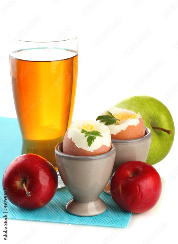 Light breakfast with boiled eggs and glass of juice, isolated Light breakfast with boiled eggs and glass of juice, isolated