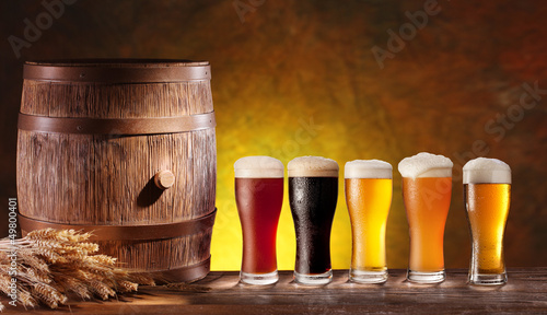 Beer glasses with a wooden barrel. #49800401