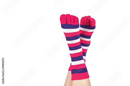 Ladies feet in socks with separated toes, isolated on white