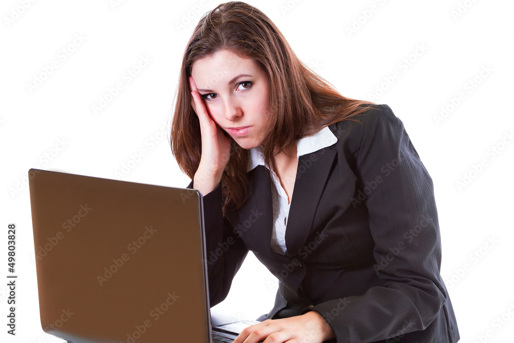 Stressful business woman working on the laptop over white Stressful business woman working on the laptop over white