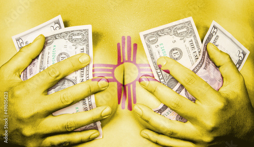Sweaty girl covered her breast with money, flag of New Mexico