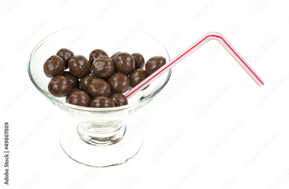 Chocolate balls in glass with straw Chocolate balls in glass with straw