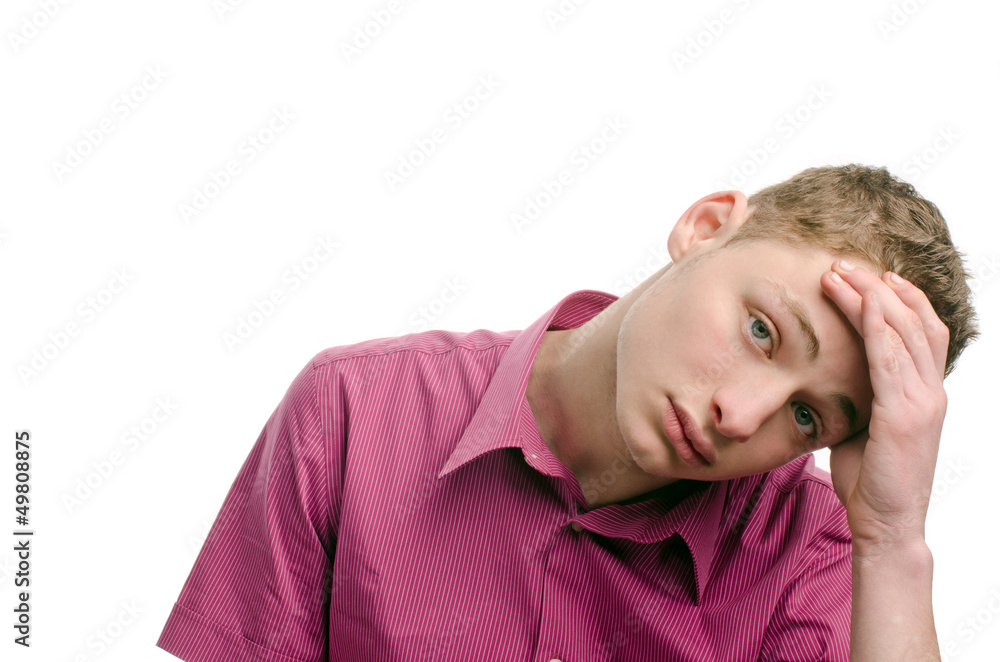 Not happy, tired, bored.Young man holding his head.. Not happy, tired, bored.Young man holding his head..