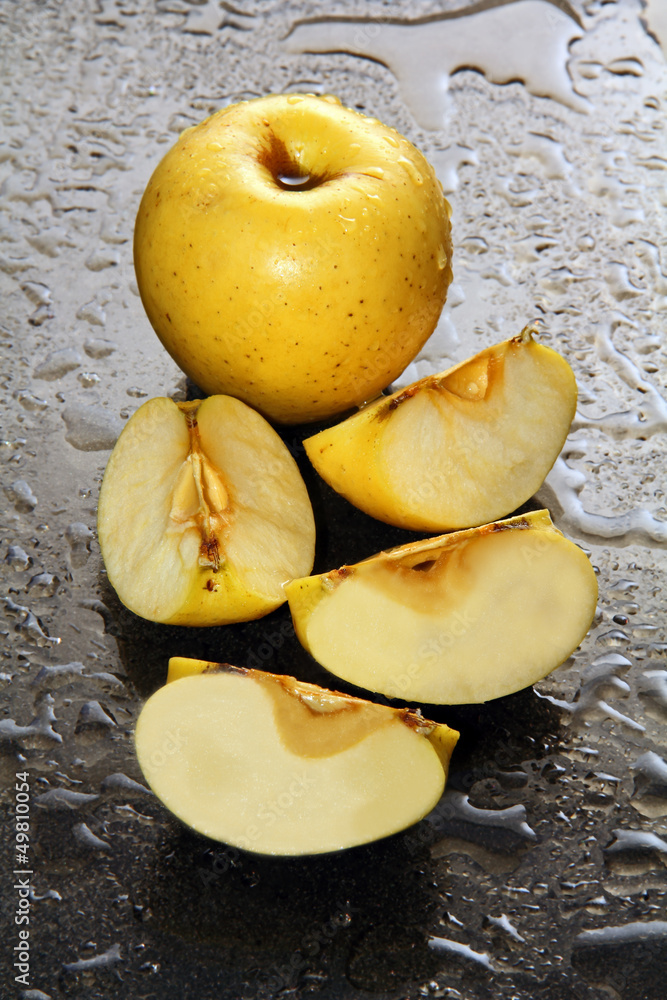 Apples on a wet glass.